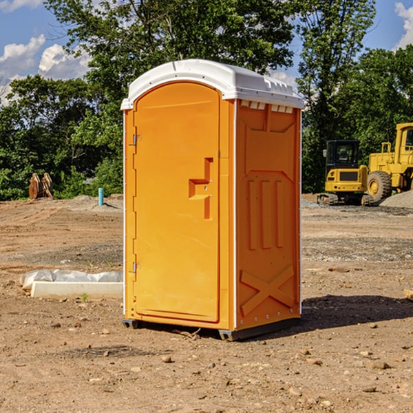 what is the cost difference between standard and deluxe portable toilet rentals in Dana